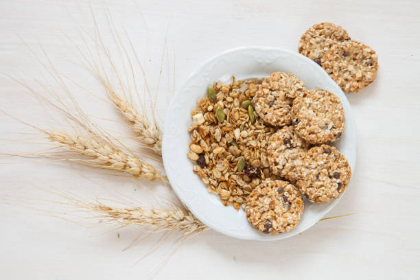 istock oatmeal cookies and muesli on a table, selective focus, the top view 1248259474