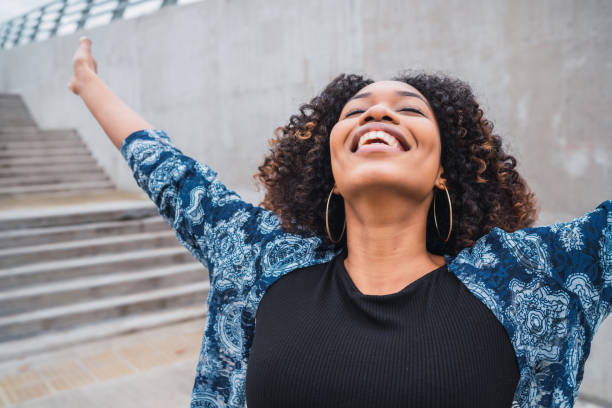 istock Afro american woman with arms raised. 1248259544