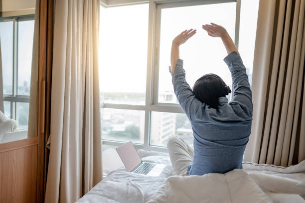 istock Businessman working with laptop on the bed 1248260390