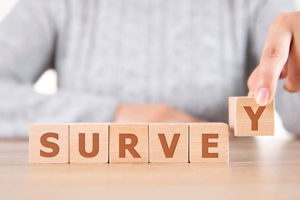 istock The Word Survey on Wooden Cube Block on Wood table 1248261193