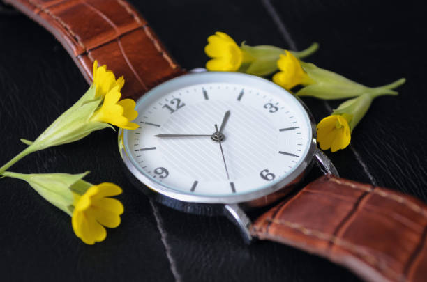 istock Watch with small yellow flowers 1248264059