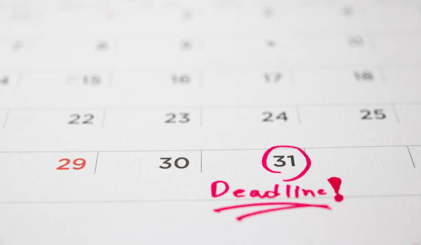 istock Deadline write on white calendar page date close up 1248264342