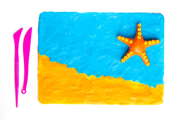 Plasticine modeling starfish. Sea background. Travel Top view