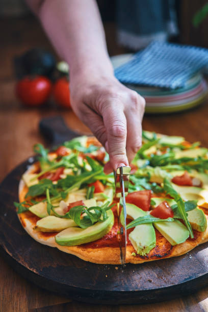 istock Vegan Pizza with Avocado, Tomato and Almonds 1248265859
