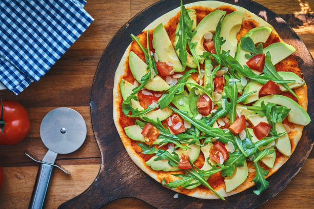 istock Vegan Pizza with Avocado, Tomato and Almonds 1248265958