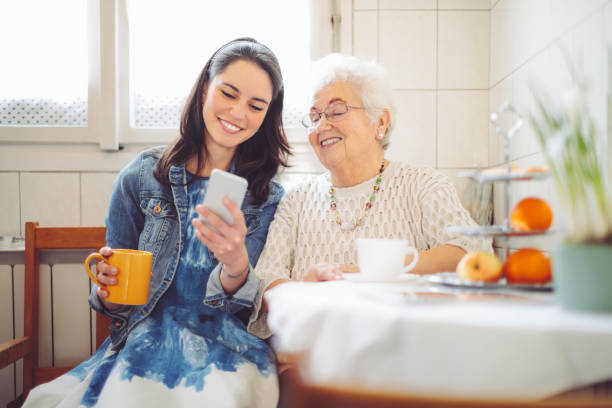 istock Social worker is visiting a senior woman 1248266434