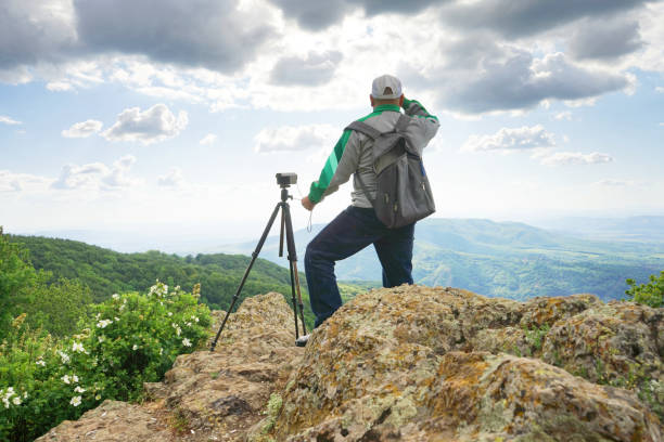 istock A Man Taking Picture In The Mountain 1248267649