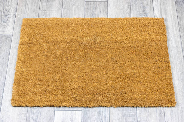 istock Blank door mat on grey vinyl floor 1248269384
