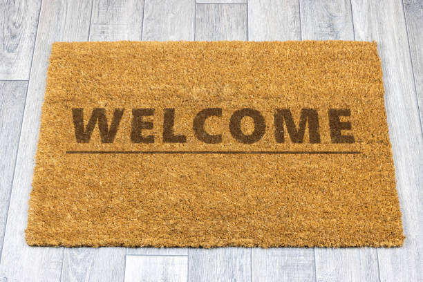 istock Welcome door mat on grey vinyl floor 1248269429