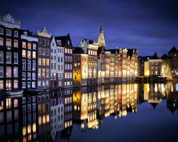 istock Amsterdam canal houses reflected in the water 1248269695