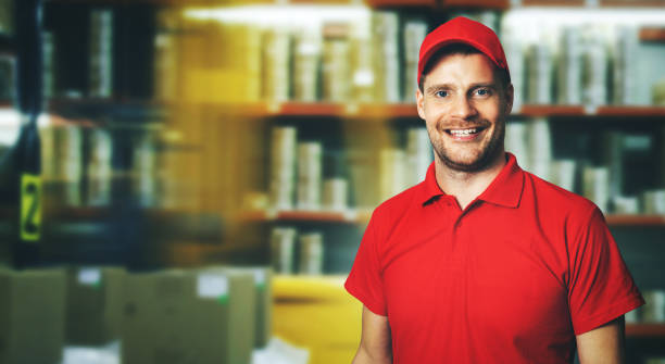 smiling warehouse manager in red uniform with copy space