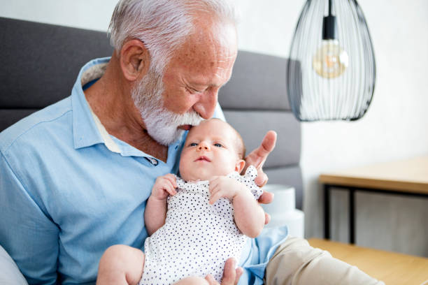 istock Grandparent holding baby 1248274931