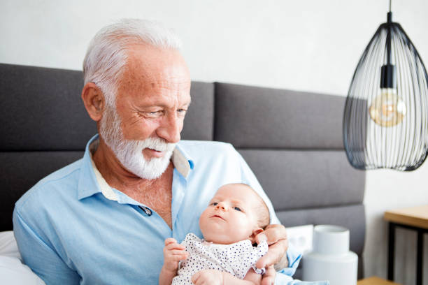 istock Grandparent holding baby 1248276027