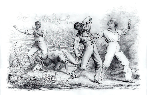 Vintage illustration shows a group of four black men, possibly freedmen, ambushed by a posse of six armed whites in a cornfield. The Fugitive Slave Act passed by Congress in September 1850 allowed slave-hunters to seize alleged fugitive slaves without due process of law and prohibited anyone from aiding escaped fugitives or obstructing their recovery. The law threatened the safety of all blacks, slave and free, and forced many Northerners to become more defiant in their support of fugitives.