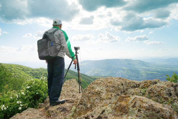 istock A Man Taking Picture In The Mountain 1248278569