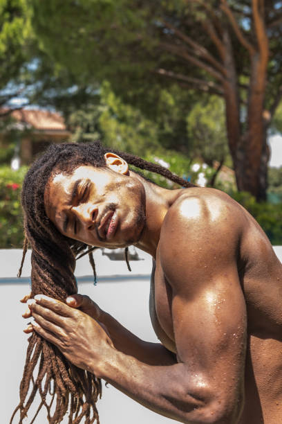 istock Young muscular black man with long dreadlocks 1248279391