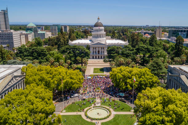 Aerial Photo of Sacramento State Capitol Building Demonstration High quality stock aerial view photo of the California State Capitol Building in Sacramento during a political rally and protest sacramento stock pictures, royalty-free photos & images