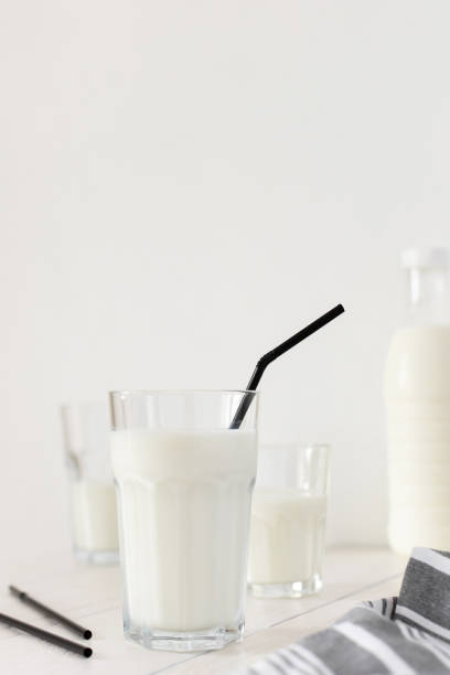 istock Fresh milk in a glasses with black straws 1248282103