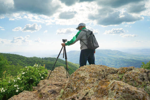 istock A Man Taking Picture In The Mountain 1248282157