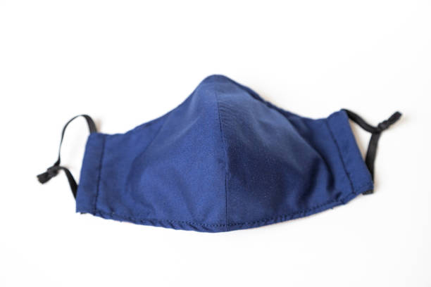 istock Homemade Blue Cloth Face Mask Isolated on White 1248282546