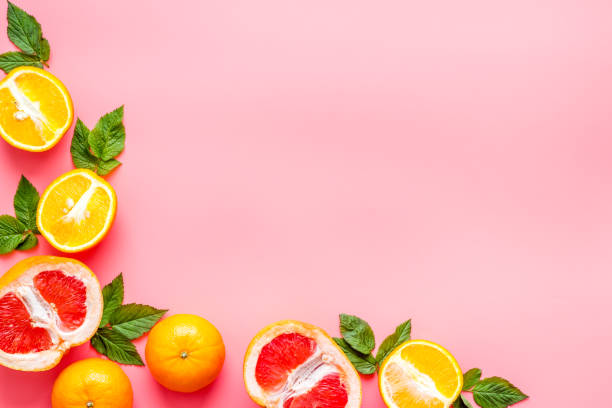 istock Citrus fruits on pink background top view 1248283302