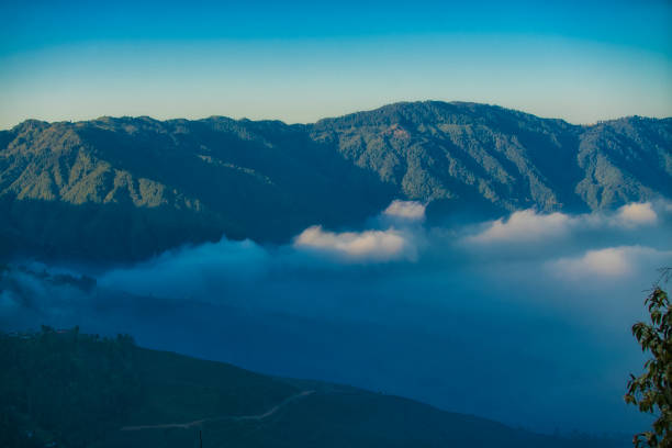 Beautiful view of local valley and mountain in misty near Linh Quy Phap An pagoda, Bao Loc town, Lam Dong Province, Vietnam. Travel and landscape concept