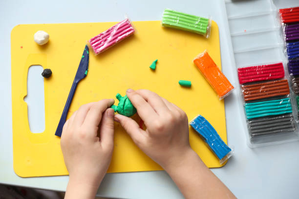 istock child's hands sculpt something from modelling clay 1248286726