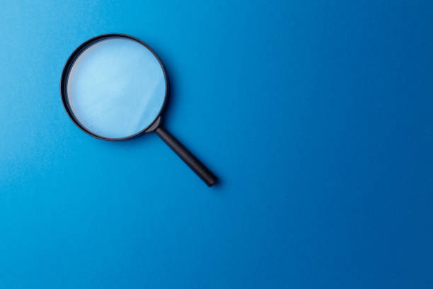 istock Concept information search. Magnifying glass on classic blue background. Top view. Flat lay. Copy space. Minimal creative concept. Trendy color. Searching information data on internet 1248286777