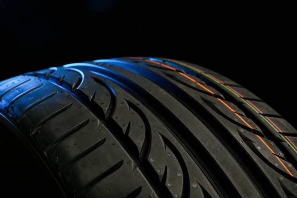 istock Tire tread on black background close up 1248286842