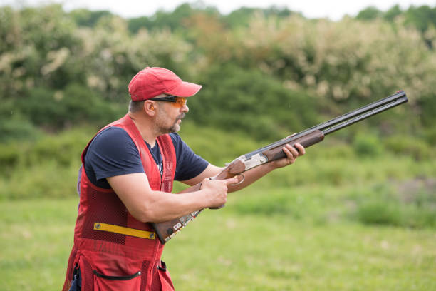istock Man shooting skeet with a shotgun. 1248287350