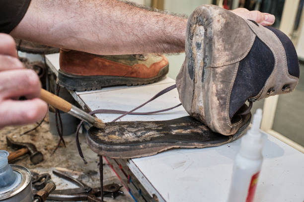 istock shoemaker man working in his shoe shop 1248287398