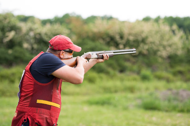 istock Man shooting skeet with a shotgun. 1248287404
