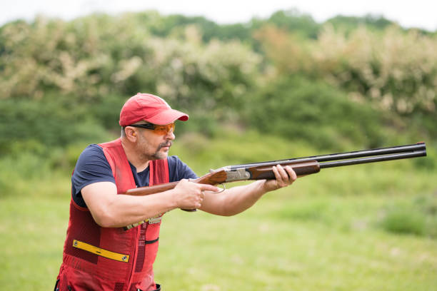 istock Man shooting skeet with a shotgun. Skeet shooting, trap shooting. 1248288520