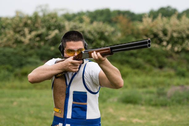istock Man shooting skeet with a shotgun. 1248288797
