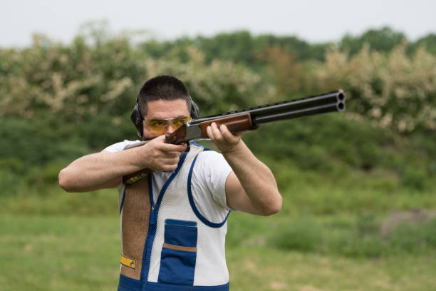 istock Man shooting on an outdoor shooting range 1248288811