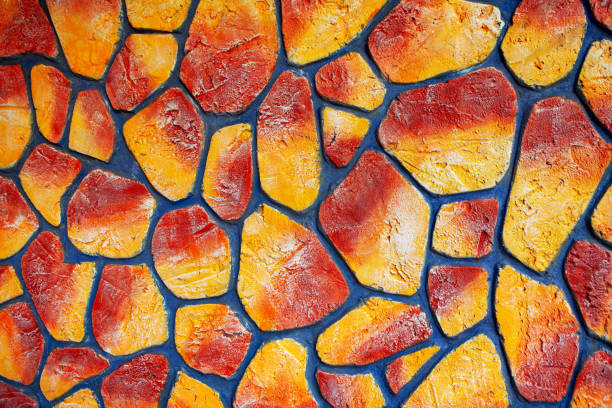 istock painted stones in red and yellow 1248288930