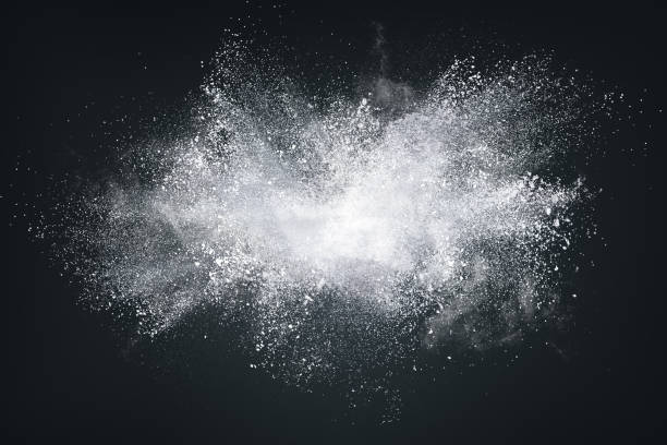 Abstract design of white powder cloud on dark background Abstract design of white powder or dust particles cloud explosion and splash with smoke flying over black background spray stock pictures, royalty-free photos & images