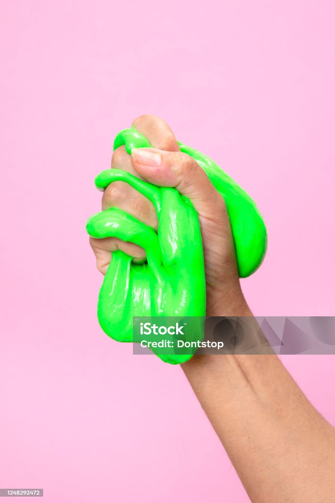 Hand Showing Fist With Neon Green Slime Toy On Pink Pop Art Backgound Stock  Photo - Download Image Now - iStock