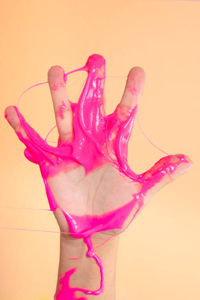 istock Hand showing number five with Neon pink slime toy on orange pop art backgound. 1248292649