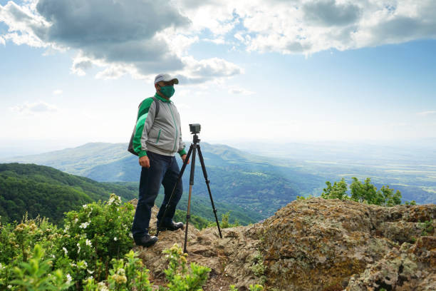 istock A Man With a Mask Taking Picture 1248294304