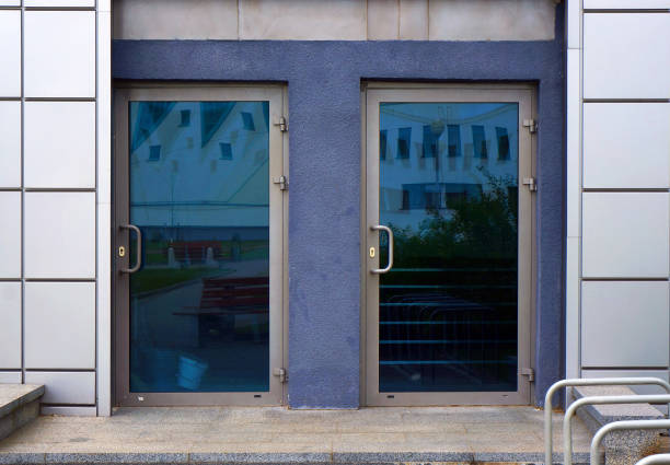 istock Two closed glass entrance doors of modern building. 1248298034