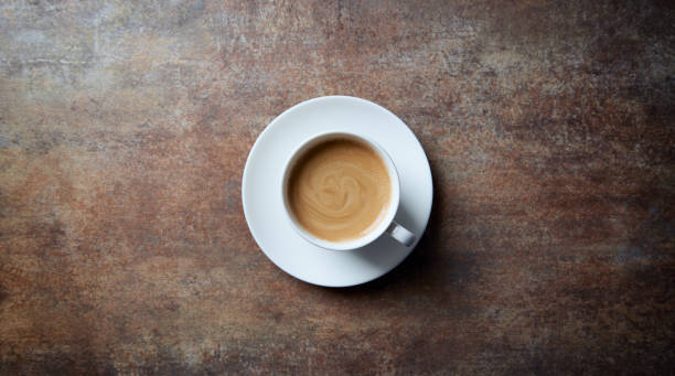 istock Cup of coffee on rustic stone background. Top view. Copy space. 1248298242