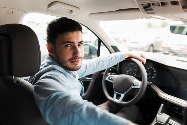 istock Business man driving a luxury car 1248300676
