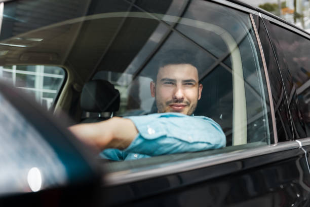 istock Successful stylish man outside the car window 1248300692