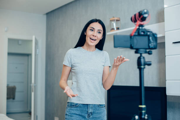 istock Mirthful teacher making video lessons from home 1248302161