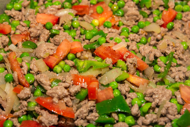 istock minced meat, peas, green peppers and tomatoes chopped over a pan 1248302759