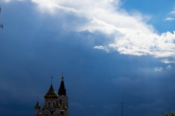 istock Church against the dark sky before a thunderstorm. 1248308017