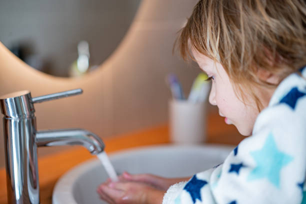 istock Little boy washing face 1248310359