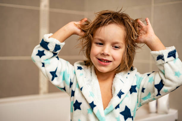 istock Little child in bathrobe after bath 1248310423