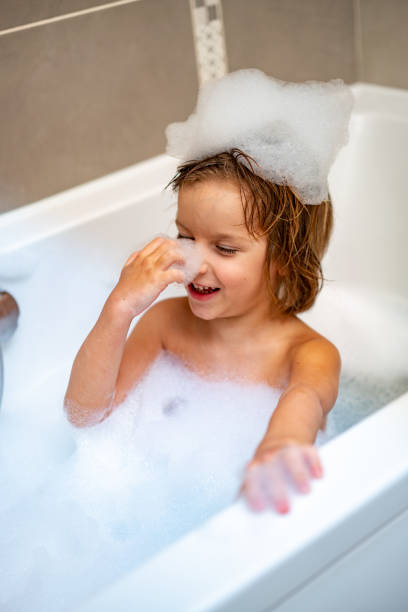 istock Cute child with foam on his head 1248311027